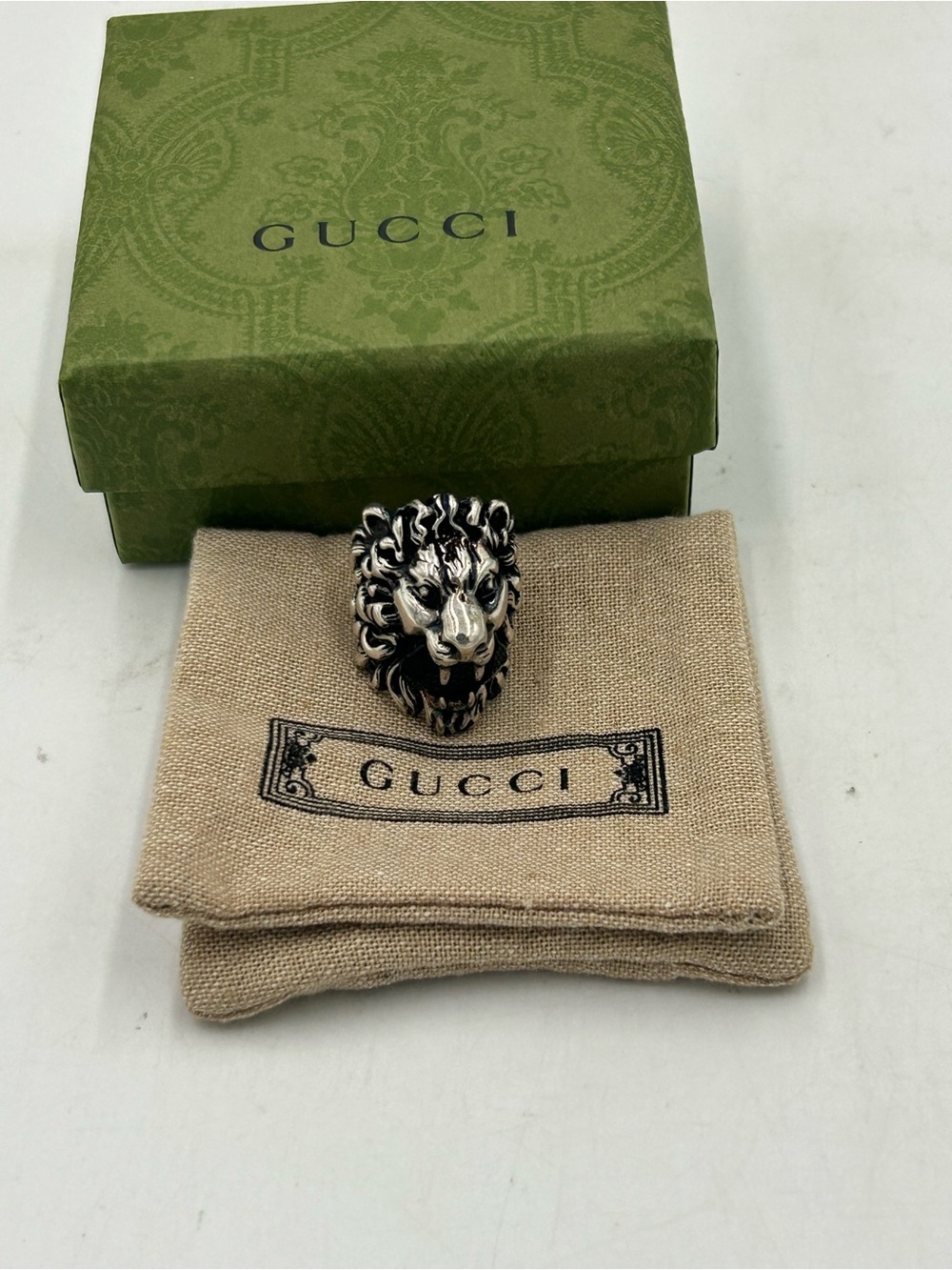 Unisex Gucci, Silvertone, Lionhead motif ring with black crystal size 6